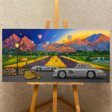 Load image into Gallery viewer,  Mercedes SL300 meets mountains at sunrise. Symbolic soap bubbles dance amid colourful fields, embodying luck and abundance. Realism and symbolism unite in this oil painting, a daily reminder of nature&#39;s harmony and the journey toward prosperity. 
