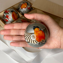 Load image into Gallery viewer, bullfinch bird painting on wooden handmade round bauble, silver color, hand-painted by Anastasia Kurganova 
