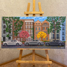 Load image into Gallery viewer, Luxurious Rolls-Royce Phantom&#39;s grace Manhattan&#39;s streets amid blooming trees, merging opulence with spring&#39;s renewal. A symbol of prosperity, this oil painting captures architecture&#39;s splendour against a backdrop of bustling city life. 
