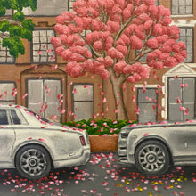 Load image into Gallery viewer, Luxurious Rolls-Royce Phantom&#39;s grace Manhattan&#39;s streets amid blooming trees, merging opulence with spring&#39;s renewal. A symbol of prosperity, this oil painting captures architecture&#39;s splendour against a backdrop of bustling city life. 
